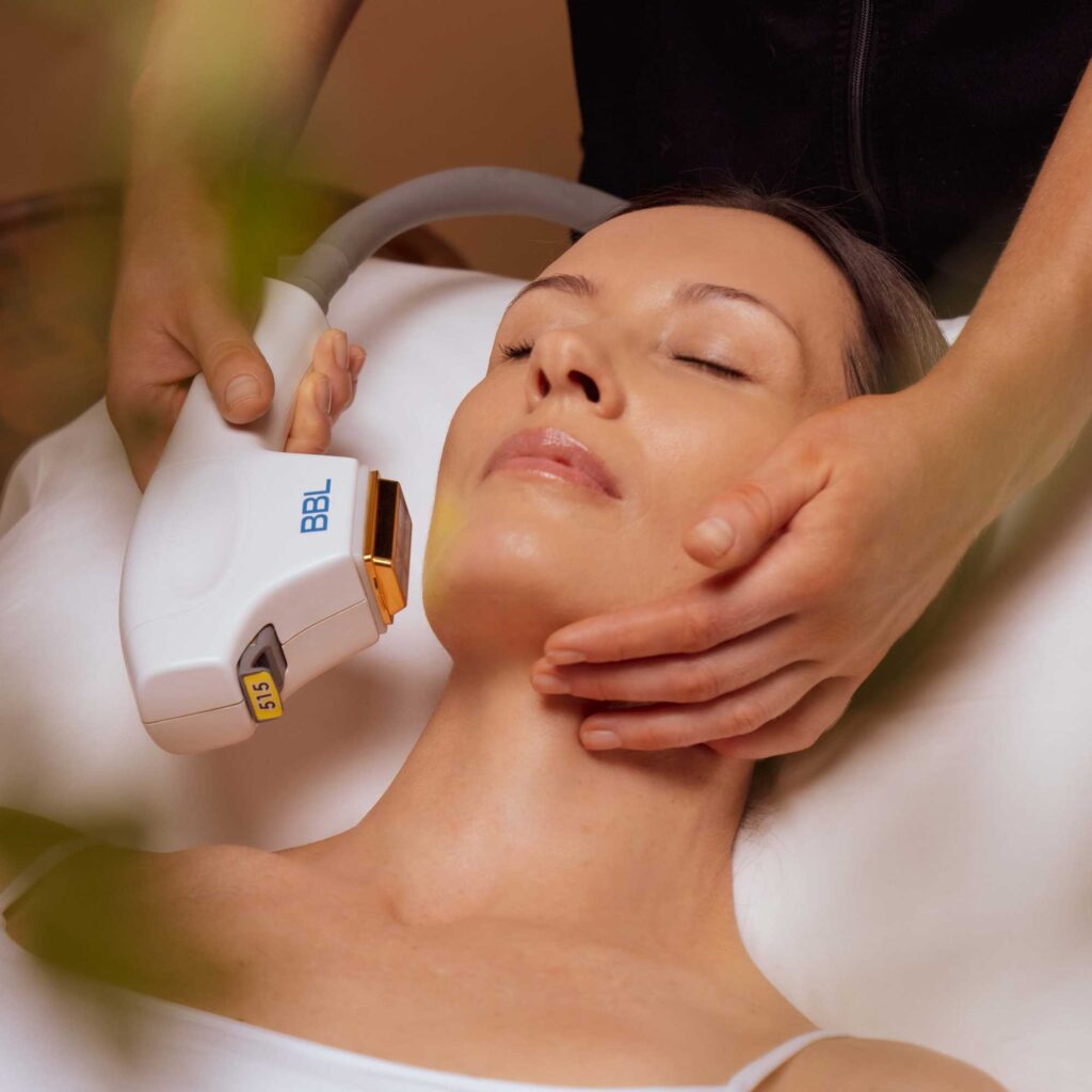 Woman receiving Forever Bare BBL treatment for hair removal at Encompass Wellness & Aesthetics.
