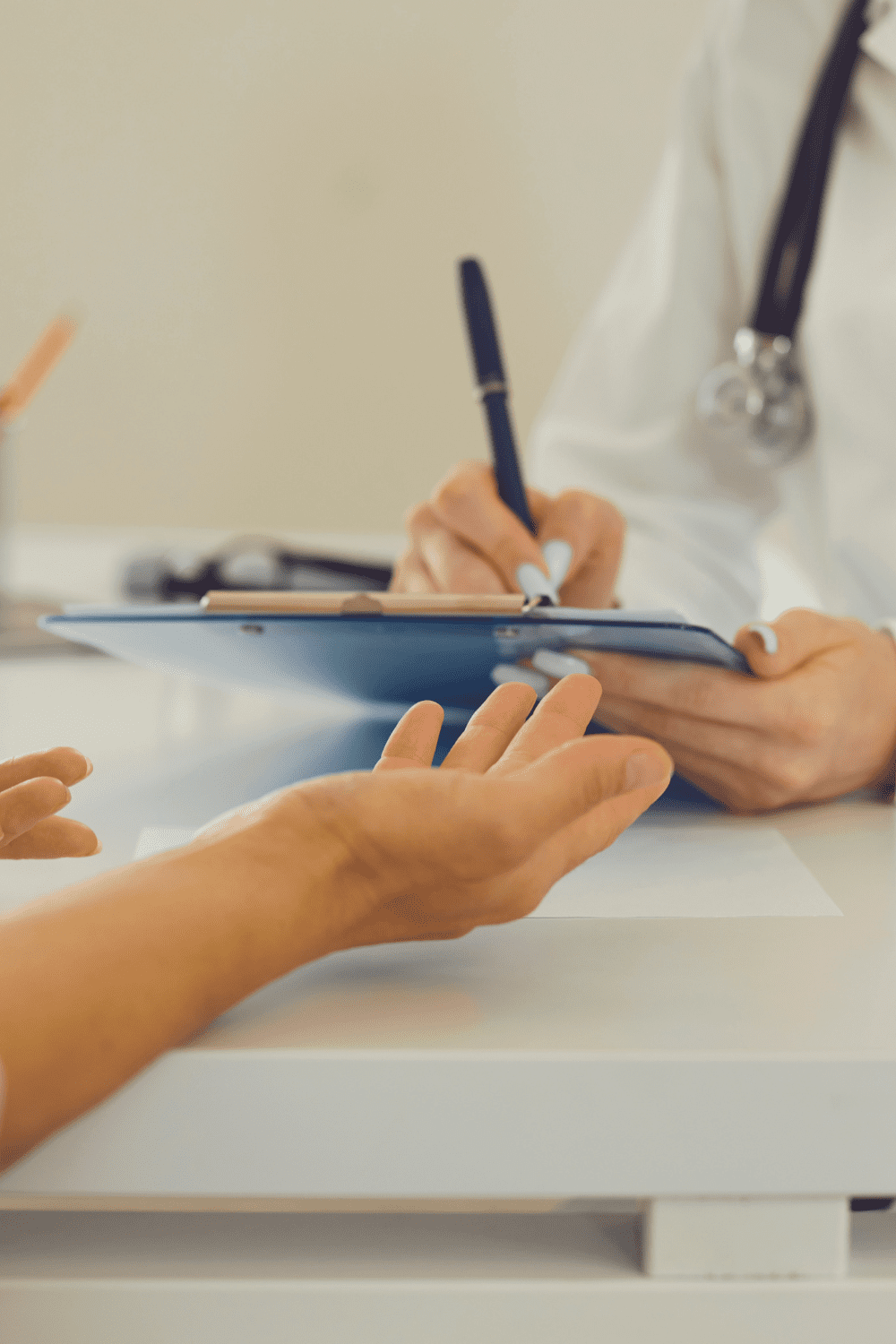 Patient receiving forms at Encompass Wellness and Aesthetics