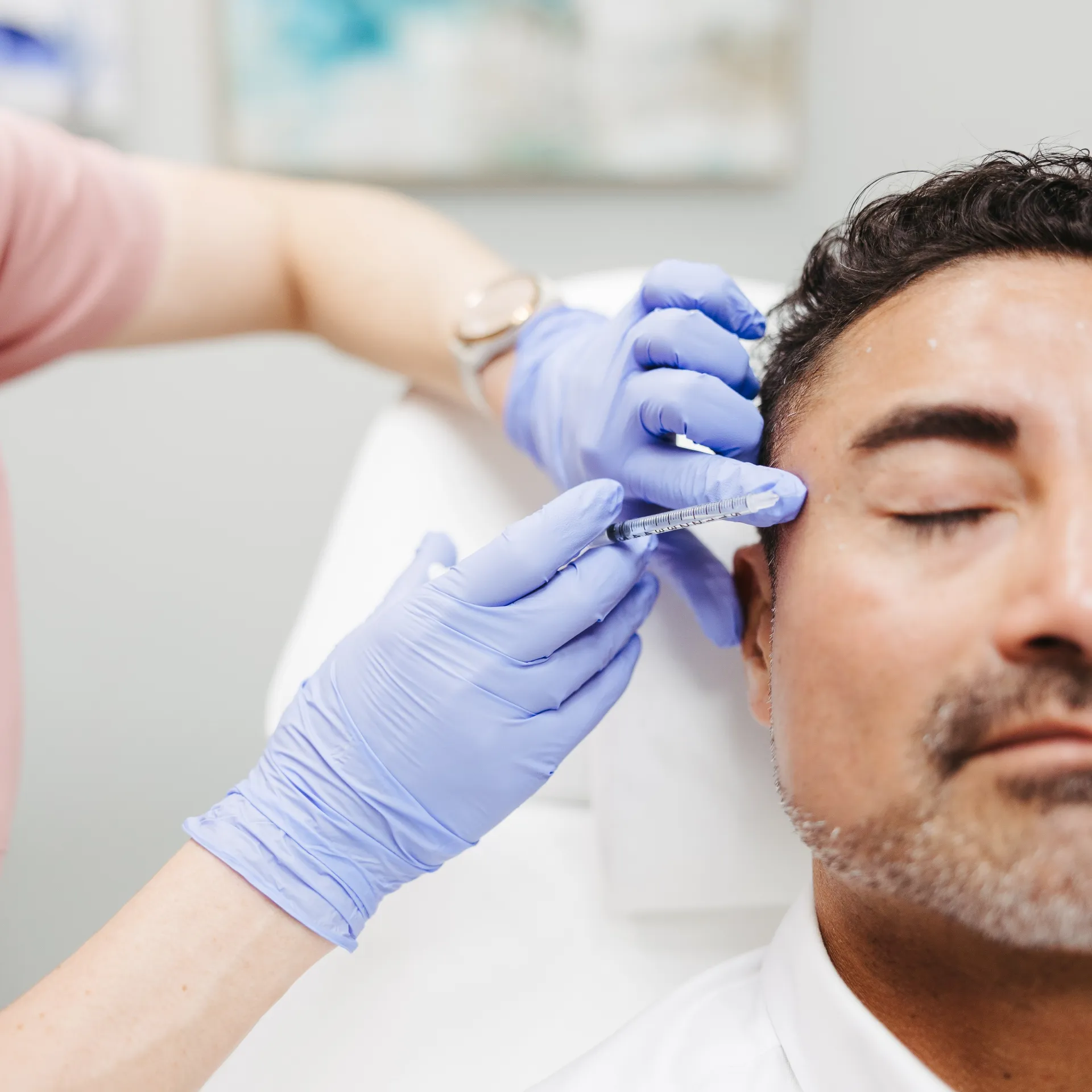 An Encompass Wellness & Aesthetics customer being injected for injectables treatment.