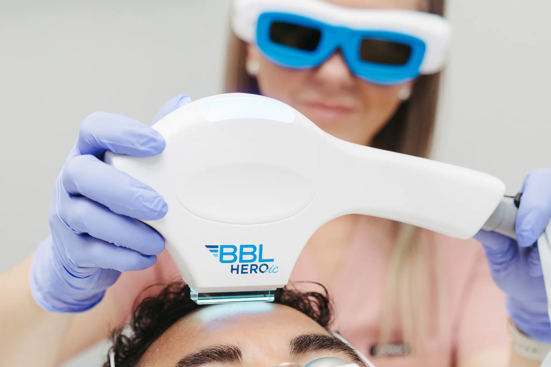 A close-up of a patient at Encompass Wellness & Aesthetics receiving Forever Clear BBL treatment.