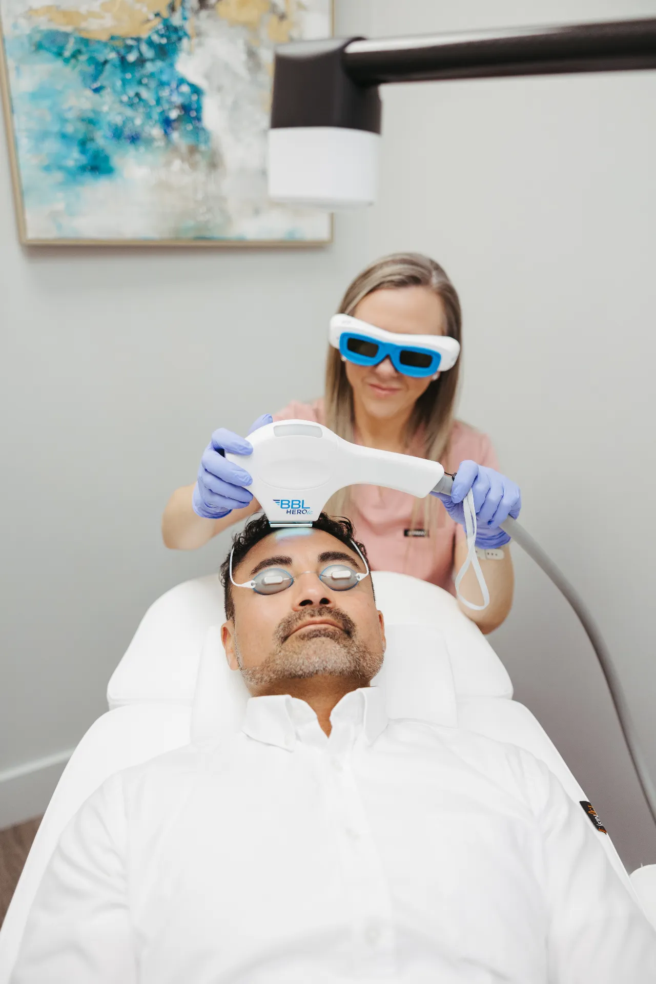 A patient at Encompass Wellness & Aesthetics receiving Forever Clear BBL treatment.