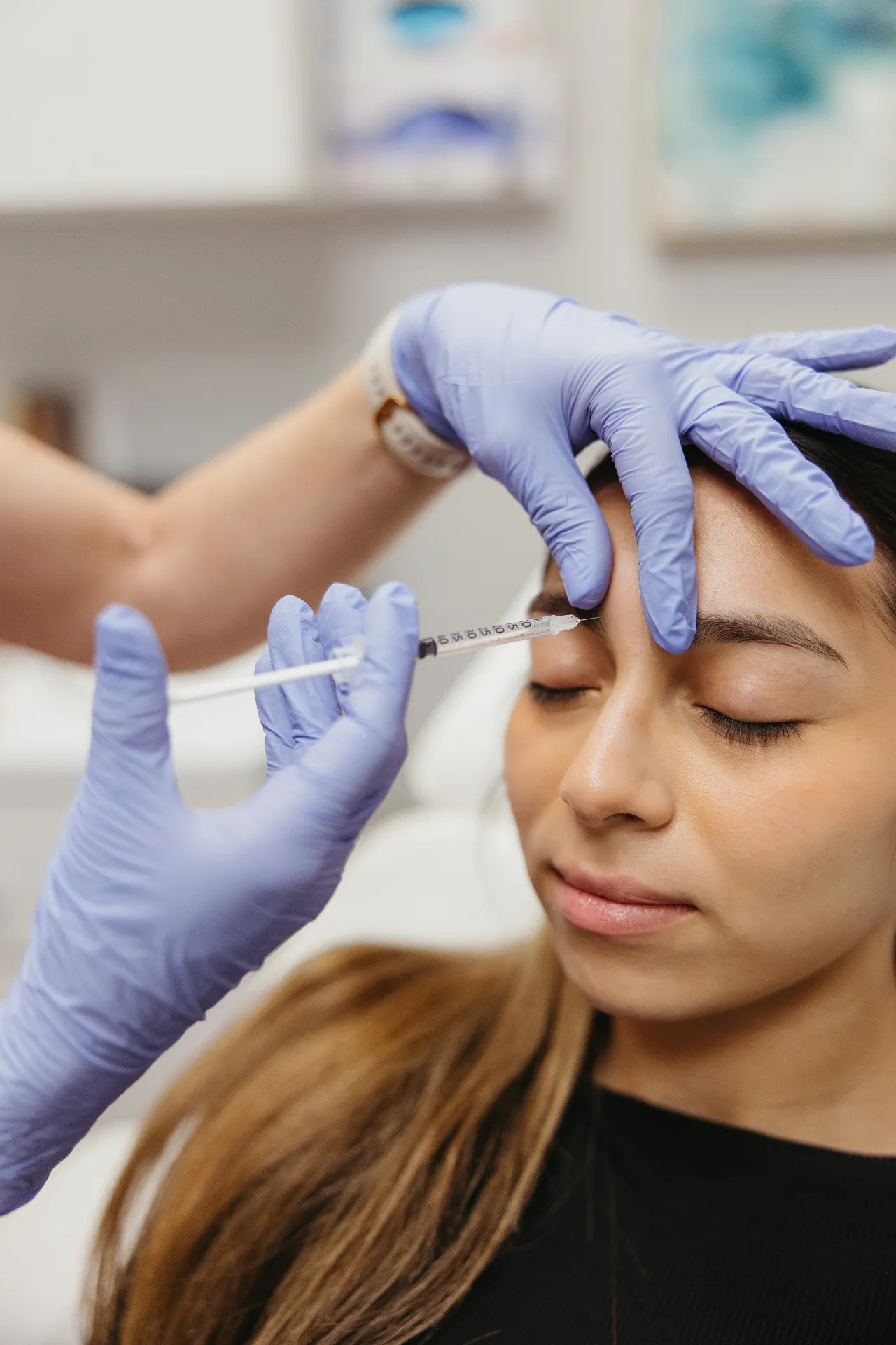 An Encompass Wellness & Aesthetics customer receiving aesthetic fillers.