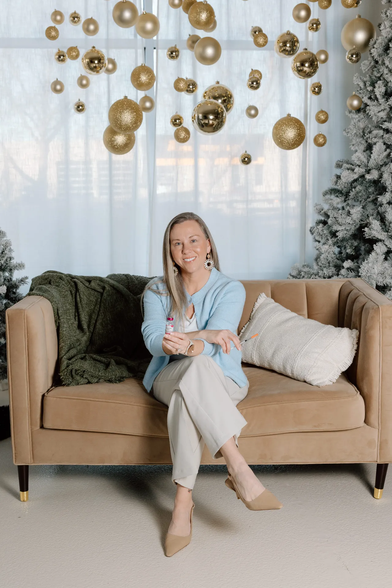 CEO and Provider Mary Jordan holding a wellness injection vial and syringe for Functional Wellness care