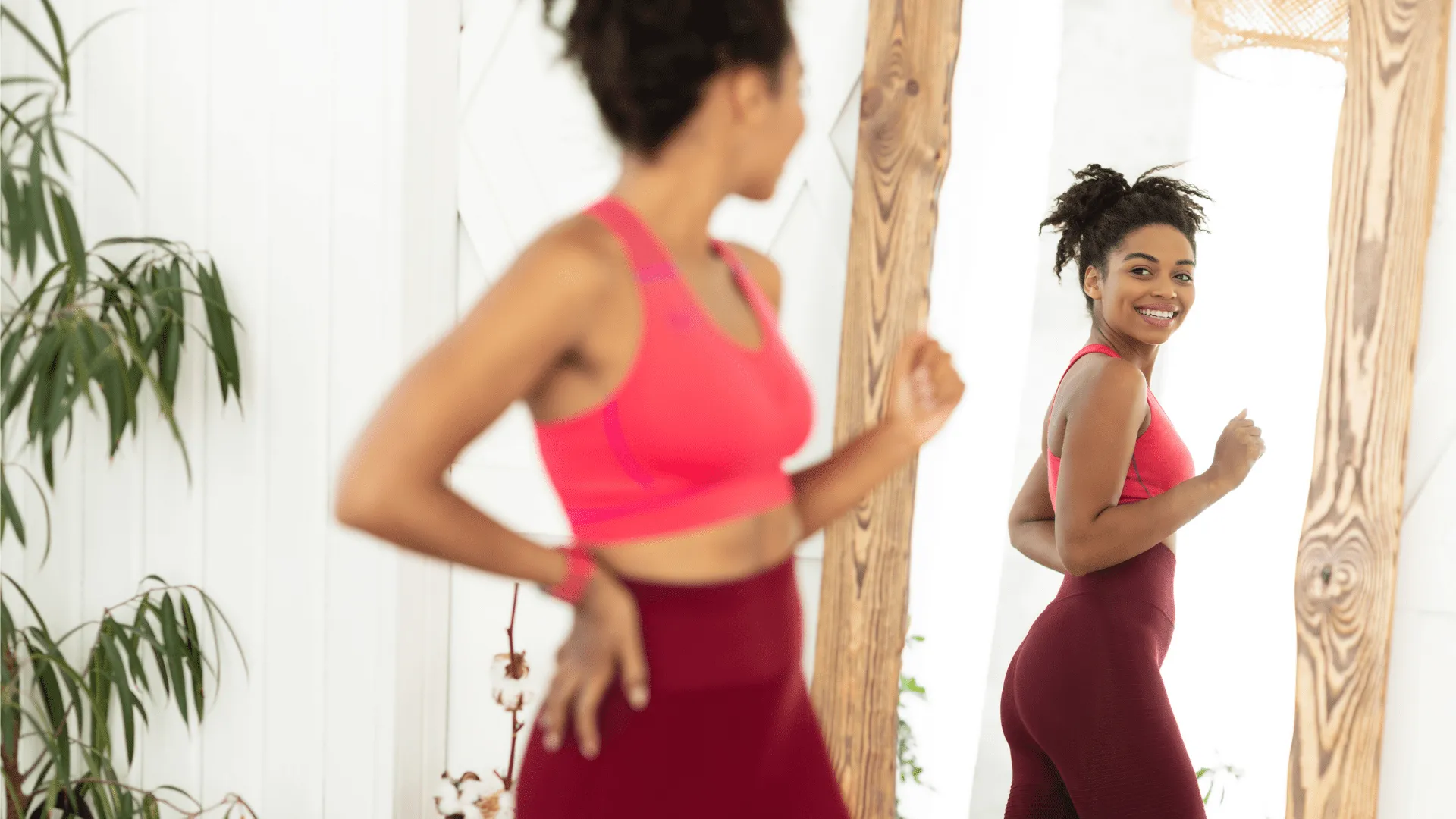 Woman admiring her body after reaching her weight goal with Medical Weight Loss at Encompass Wellness & Aesthetics.