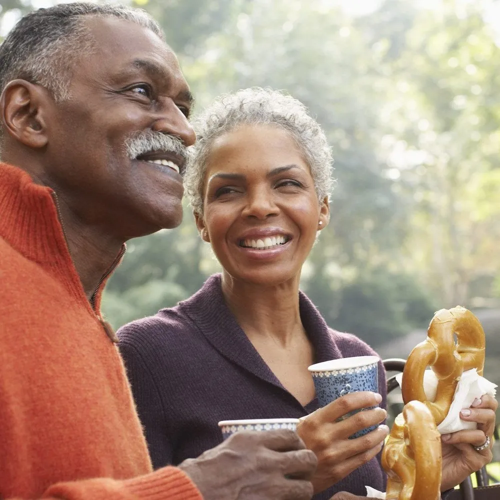Smiling couple after receiving hormone replacement therapy from Encompass Wellness & Aesthetics.