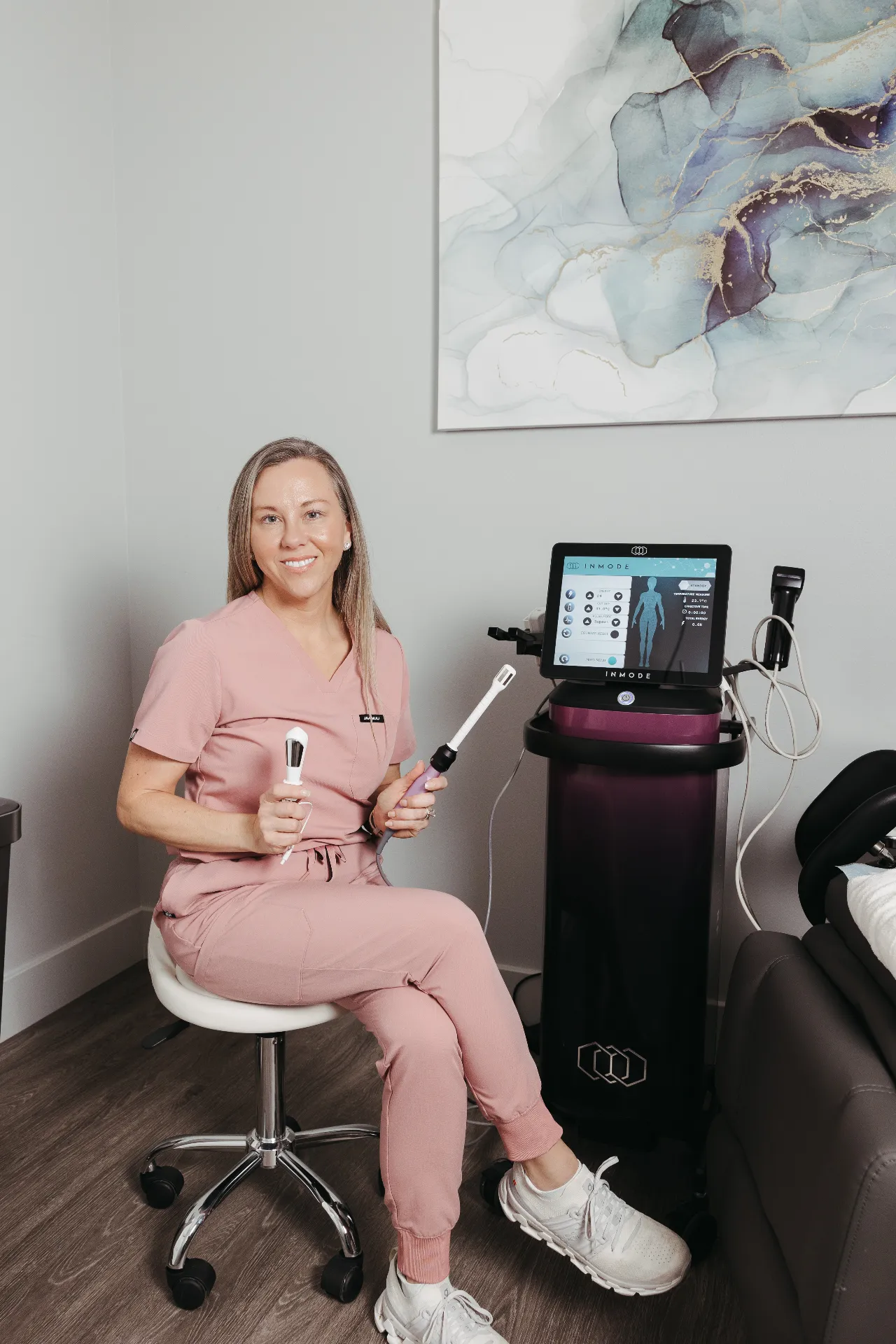 Encompass Wellness provider with FormaV and Vtone treatment devices beside the InMode system used for women's intimate wellness