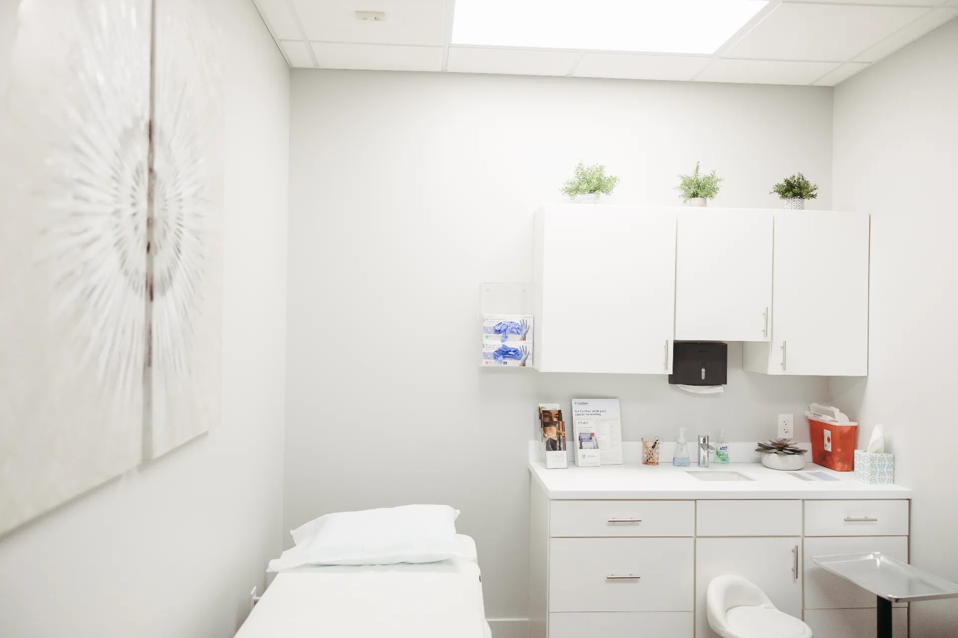 Encompass Wellness O-Shot treatment room with comfortable patient bed and warm lighting in Sioux Falls clinic