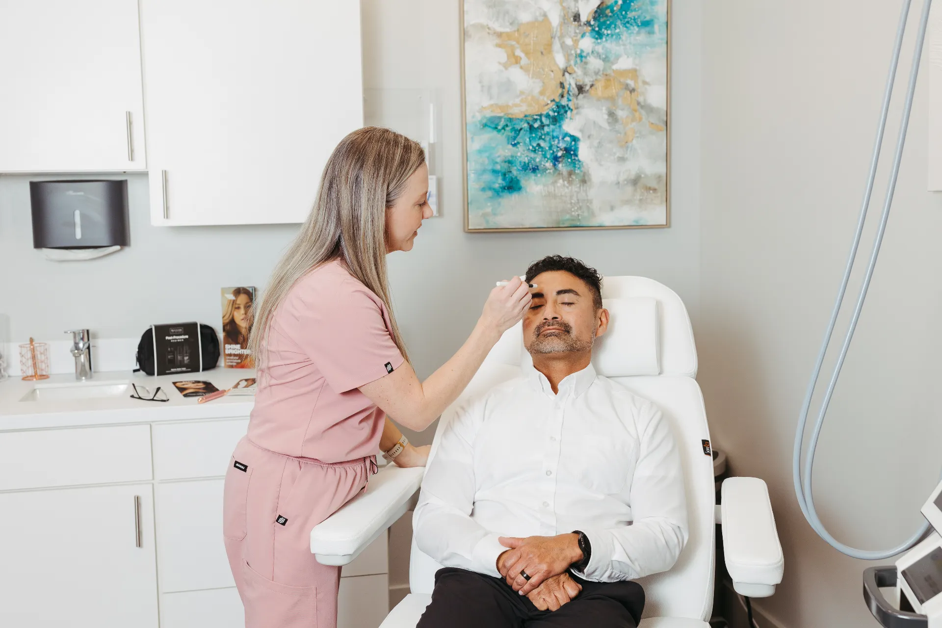 Encompass provider preparing male patient for treatment at Sioux Falls men's health clinic