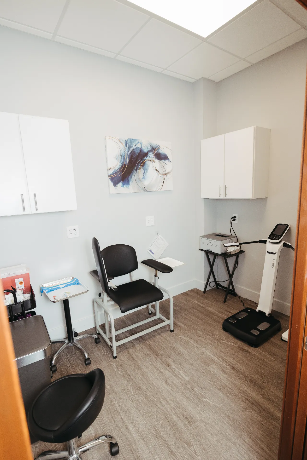Medical intake room at Encompass Wellness with blood draw chair and lab monitoring equipment for hormone therapy