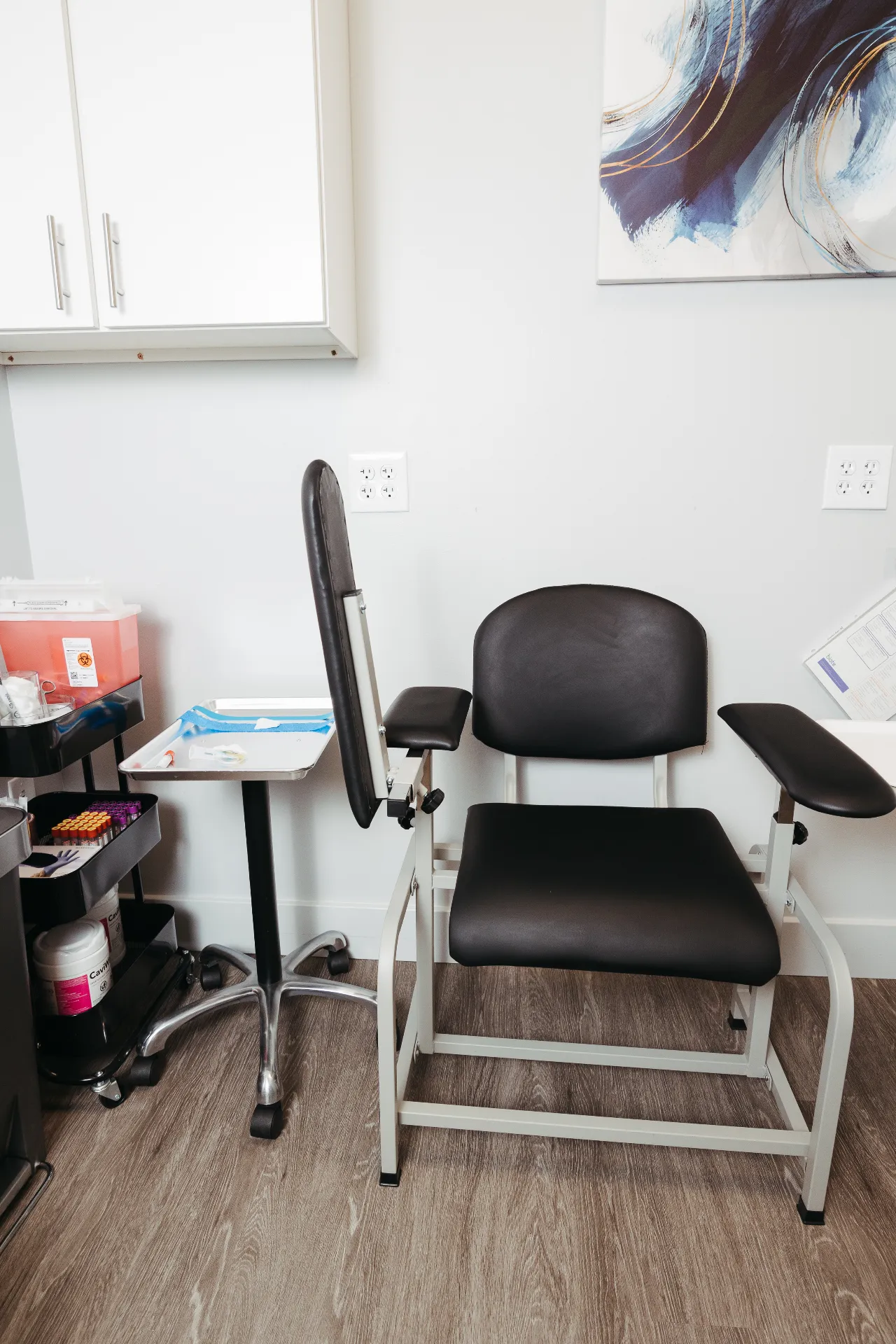 Blood draw chair and side table in the Encompass Wellness intake room for PRP preparation