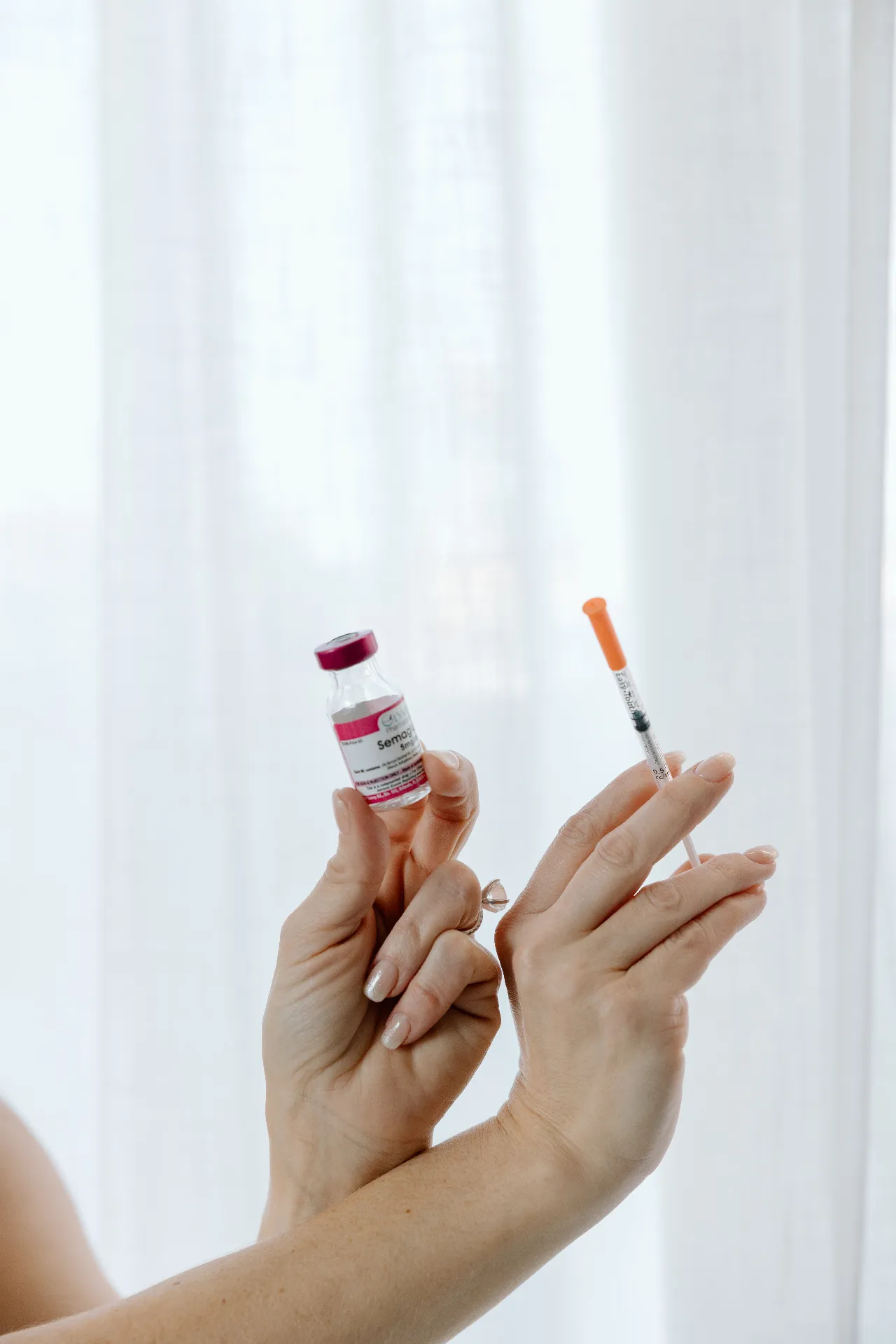 Sermorelin peptide therapy vial and syringe at Encompass Wellness