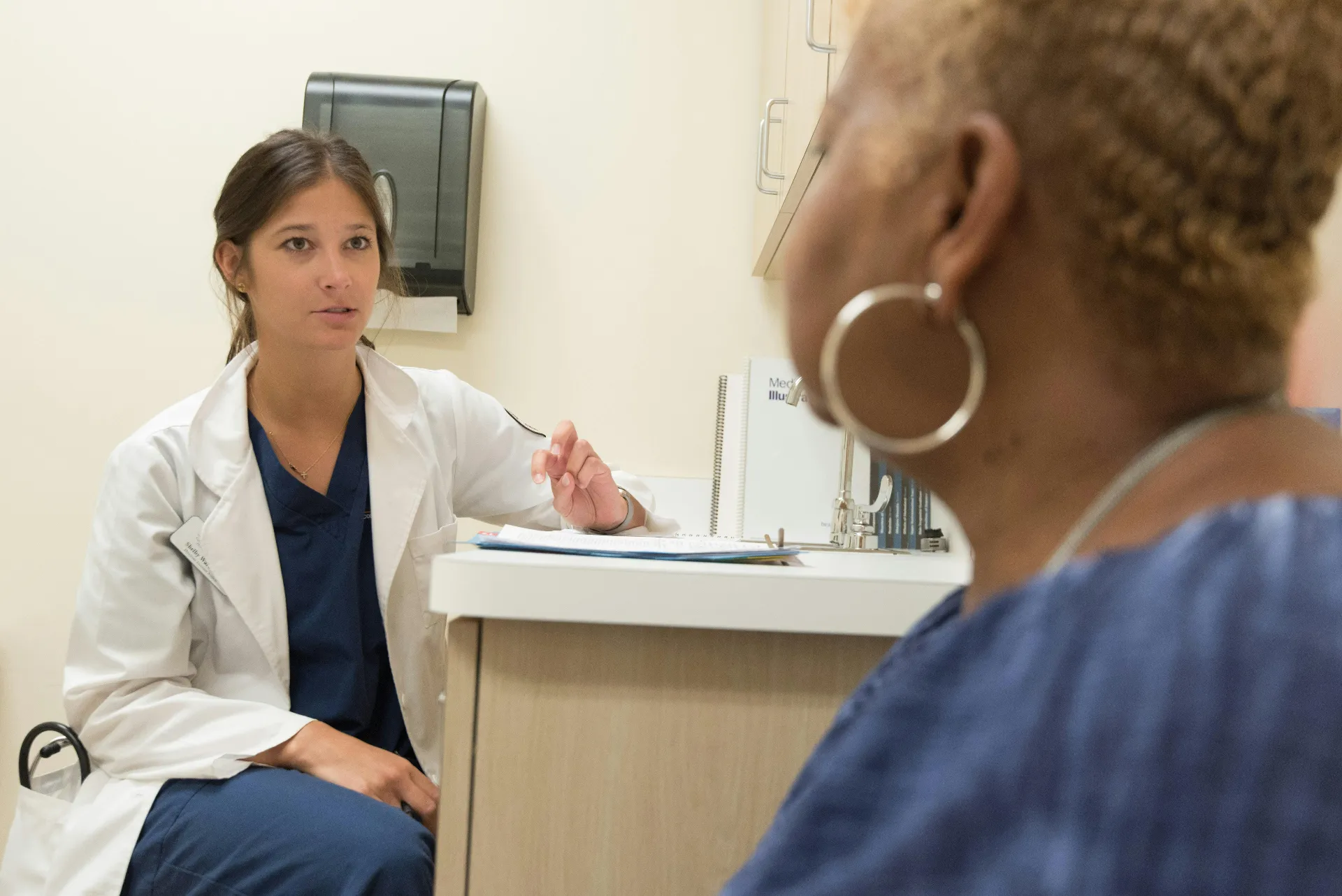 Provider reviewing early cancer screening options with patient at Encompass Wellness