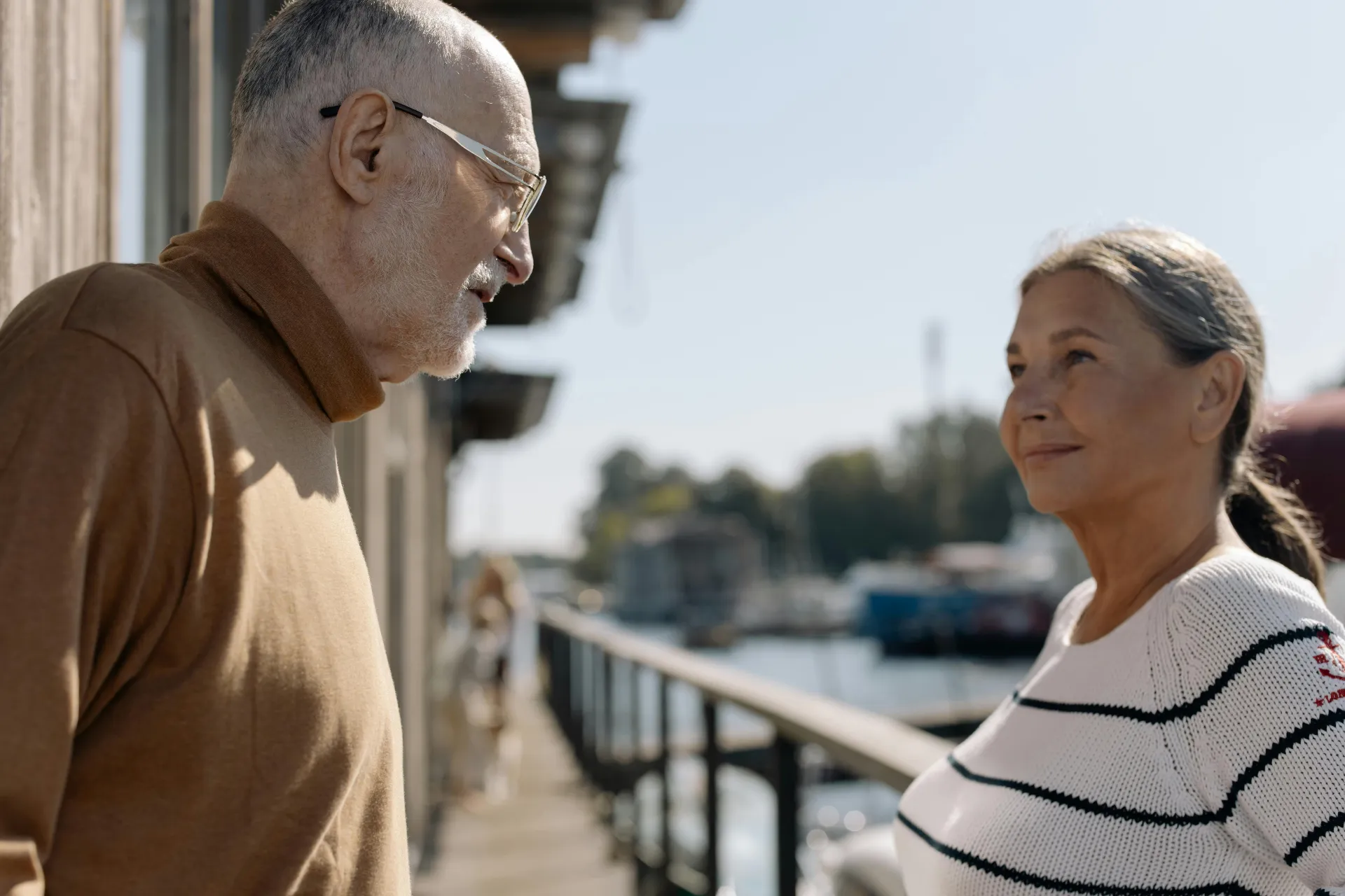 Mature couple smiling together outdoors — confidence and connection restored with Storz Therapy ED treatment